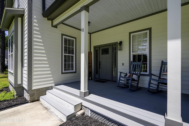 wooden terrace with covered porch