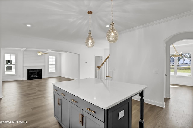 65 Tilloo Cut Way, Hampstead, NC 28443 - kitchen featuring gray cabinets, a ceiling fan, dark wood-type flooring, arched walkways, and pendant lighting