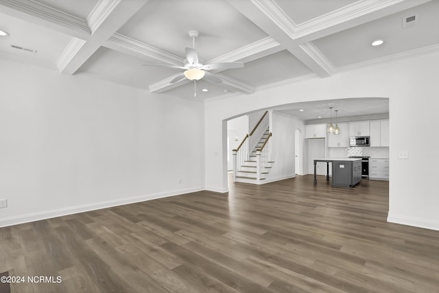 65 Tilloo Cut Way, Hampstead, NC 28443 - unfurnished living room with coffered ceiling, beam ceiling, stairway, arched walkways, and recessed lighting