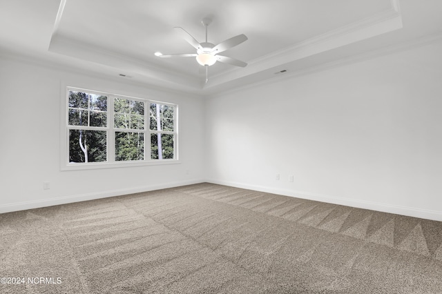 65 Tilloo Cut Way, Hampstead, NC 28443 - carpeted empty room with a tray ceiling, crown molding, a ceiling fan, and baseboards