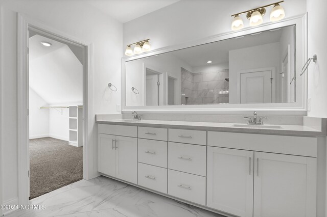 65 Tilloo Cut Way, Hampstead, NC 28443 - bathroom with double vanity, a tile shower, and marble look tile flooring