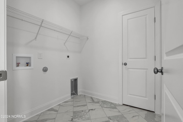 65 Tilloo Cut Way, Hampstead, NC 28443 - laundry room featuring light marble finish floors, hookup for an electric dryer, washer hookup, and baseboards