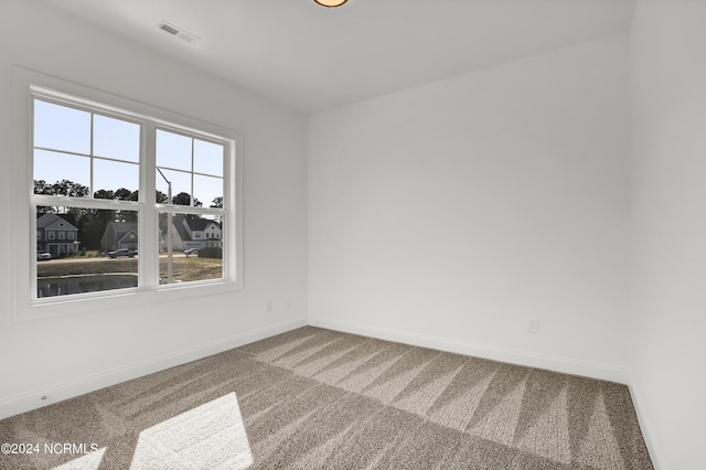65 Tilloo Cut Way, Hampstead, NC 28443 - carpeted spare room featuring baseboards