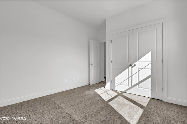 65 Tilloo Cut Way, Hampstead, NC 28443 - unfurnished bedroom with carpet floors, baseboards, and a closet