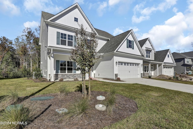 65 Tilloo Cut Way, Hampstead, NC 28443 - traditional-style home featuring stone siding, concrete driveway, a front yard, roof with shingles, and board and batten siding