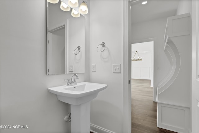 65 Tilloo Cut Way, Hampstead, NC 28443 - bathroom featuring wood finished floors and a sink
