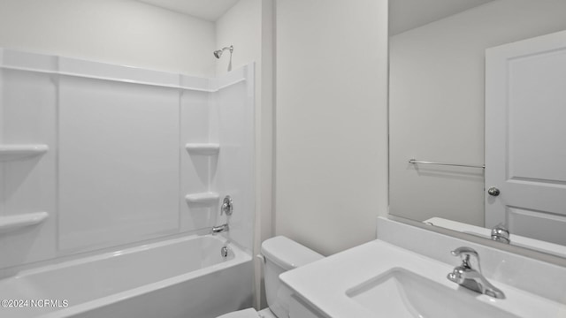 full bathroom featuring toilet, tub / shower combination, and sink