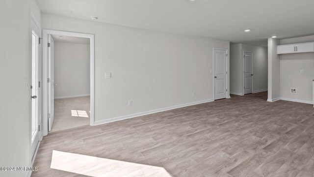 unfurnished room featuring hardwood / wood-style flooring