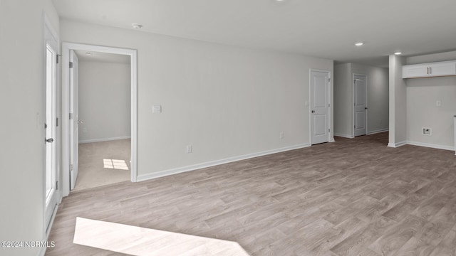 unfurnished room featuring light wood-type flooring