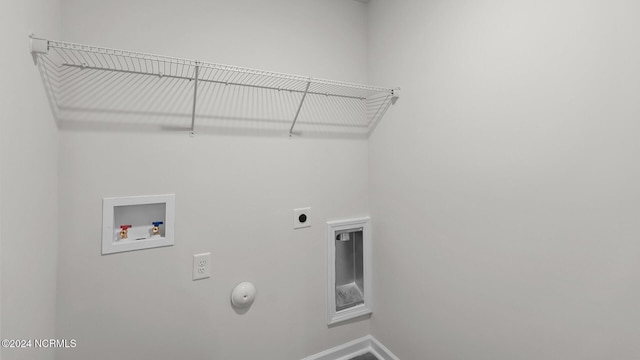 laundry area featuring hookup for an electric dryer, hookup for a washing machine, and gas dryer hookup