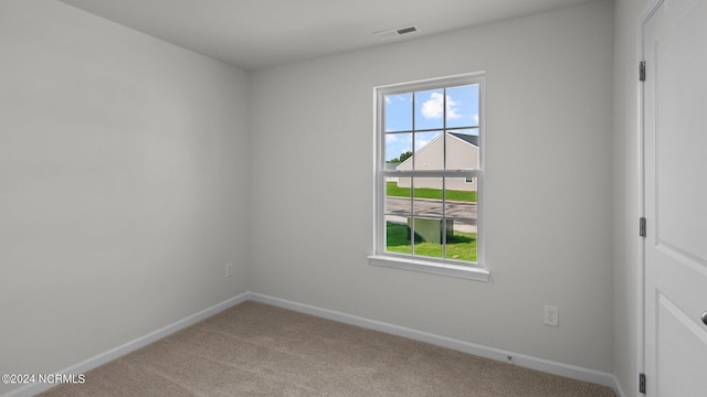 empty room featuring light colored carpet