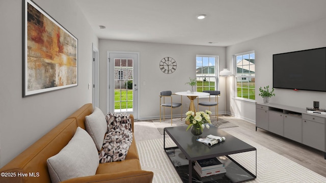 living room with light hardwood / wood-style flooring