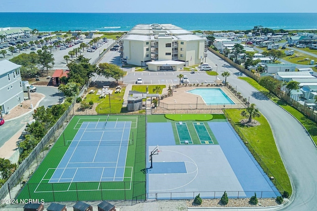 birds eye view of property with a water view