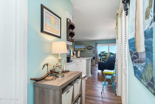 hallway with hardwood / wood-style flooring