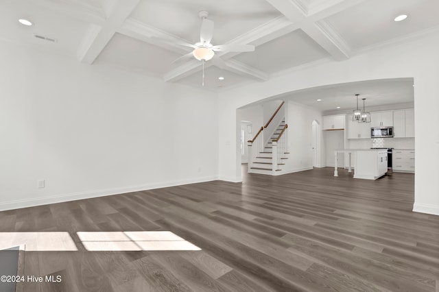 unfurnished living room with beam ceiling, dark hardwood / wood-style flooring, and ceiling fan