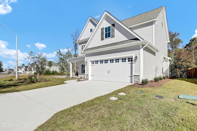 view of front facade with a garage and a front yard