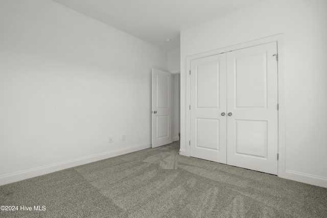 133 Tilloo Cut Way, Hampstead, NC 28443 - unfurnished bedroom with carpet floors, a closet, and baseboards