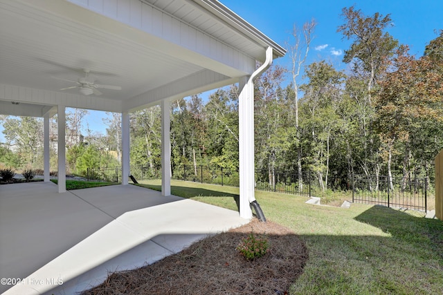 view of yard featuring ceiling fan and a patio area