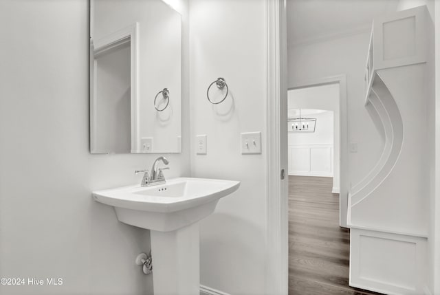 133 Tilloo Cut Way, Hampstead, NC 28443 - bathroom with crown molding, wood finished floors, and a sink