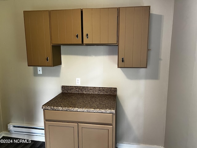 kitchen featuring baseboard heating and gray cabinets