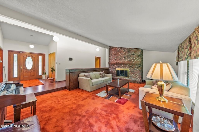 living room with lofted ceiling, a brick fireplace, a wealth of natural light, and carpet flooring