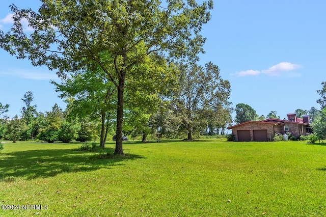 view of yard with an attached garage