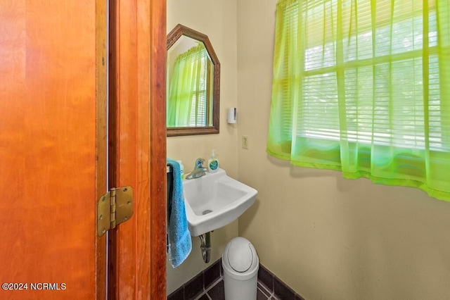 bathroom with baseboards