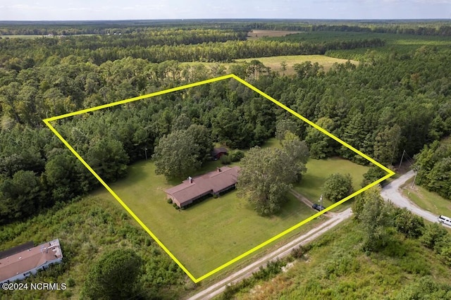 aerial view featuring a forest view and a rural view