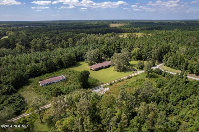 birds eye view of property with a wooded view