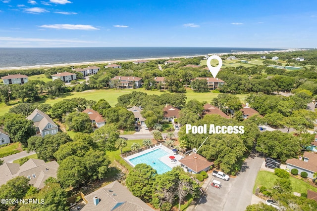 birds eye view of property featuring a water view and a residential view