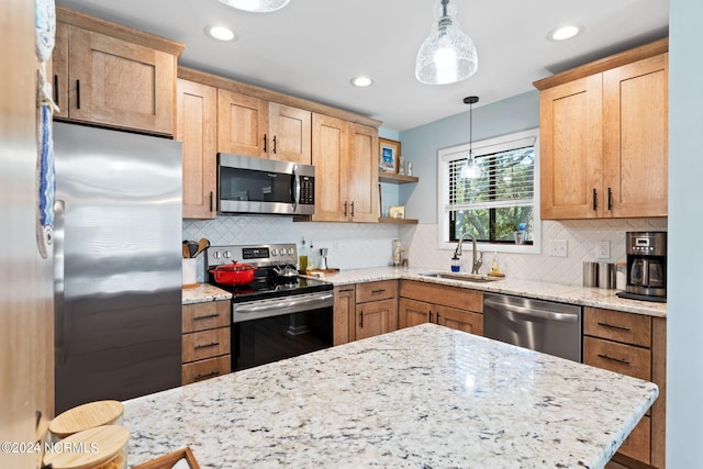 kitchen with stainless steel appliances, a sink, hanging light fixtures, decorative backsplash, and open shelves