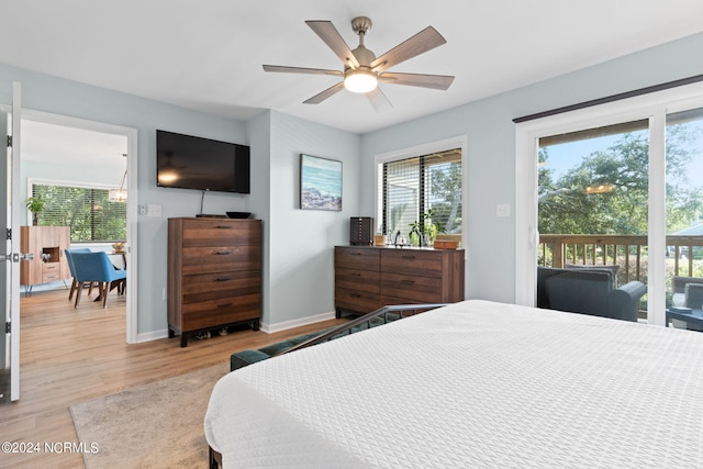 bedroom with access to outside, light wood-type flooring, a ceiling fan, and baseboards