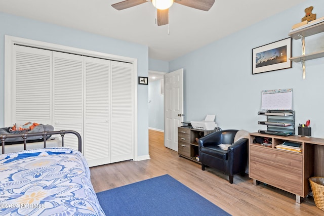 bedroom featuring light wood-type flooring, a closet, and ceiling fan