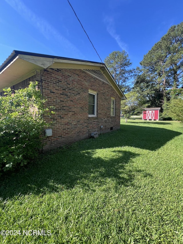 view of home's exterior with a lawn