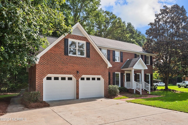 view of front of home featuring a garage and a front yard