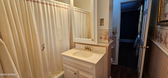 bathroom featuring shower / tub combo with curtain and vanity