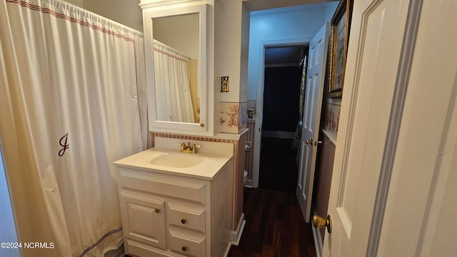 bathroom featuring vanity and hardwood / wood-style floors