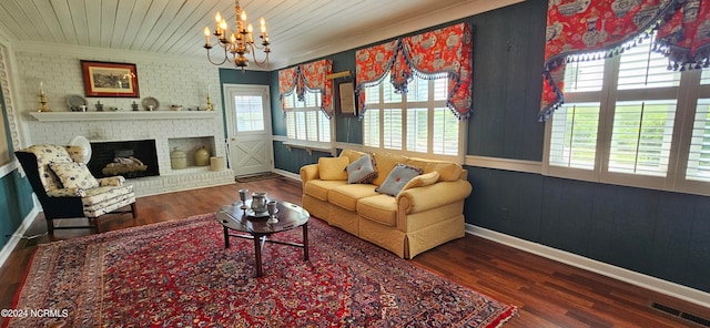 living room with wood ceiling, a fireplace, hardwood / wood-style floors, and a notable chandelier