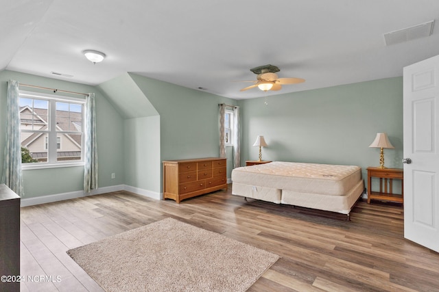 bedroom with ceiling fan and hardwood / wood-style floors