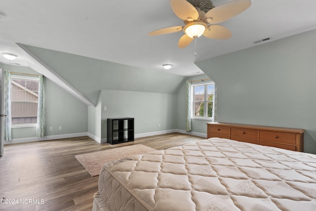 unfurnished bedroom with light hardwood / wood-style floors, lofted ceiling, and ceiling fan