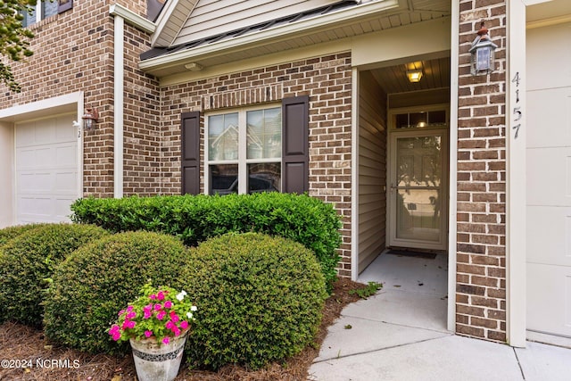 property entrance with a garage