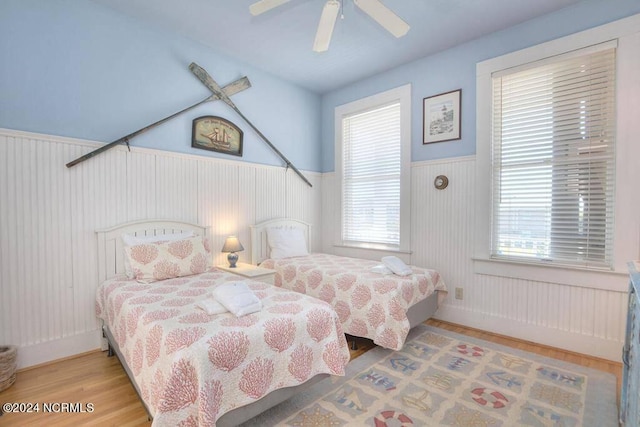 bedroom featuring hardwood / wood-style flooring and ceiling fan