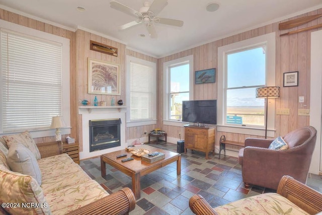 living room with wooden walls and ceiling fan