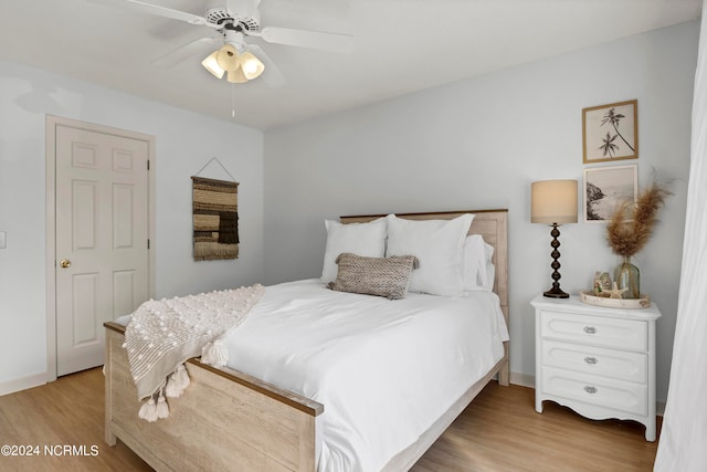 bedroom featuring light hardwood / wood-style flooring and ceiling fan