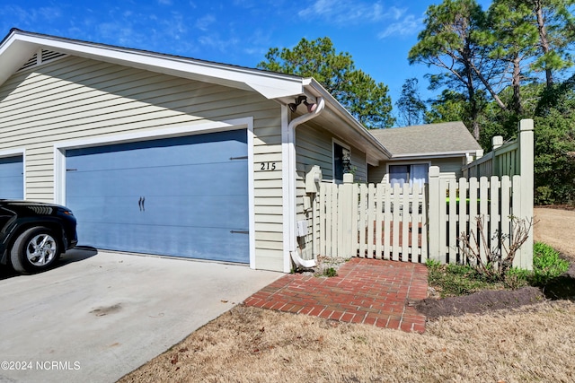 view of property exterior with a garage