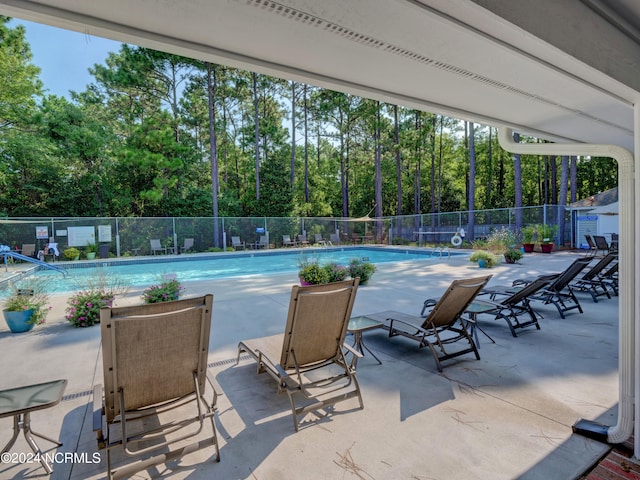 view of swimming pool featuring a patio area