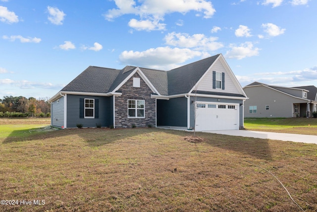 view of front of house featuring a garage and a front yard