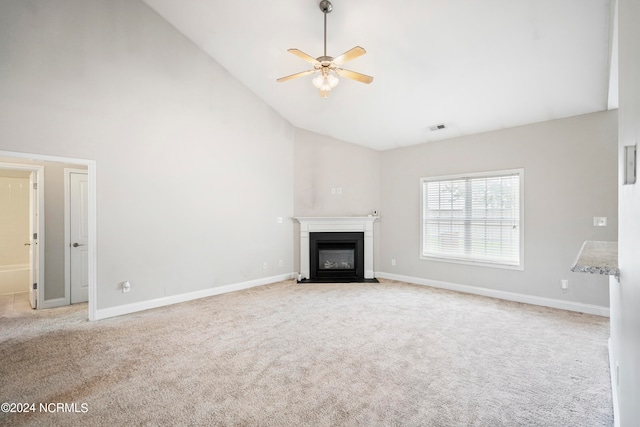 unfurnished living room featuring ceiling fan, light carpet, and high vaulted ceiling