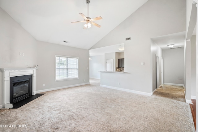 unfurnished living room featuring high vaulted ceiling, light carpet, and ceiling fan