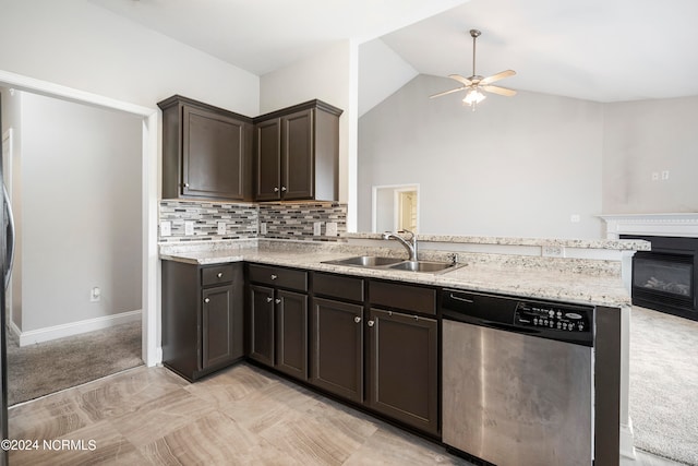 kitchen featuring stainless steel dishwasher, sink, kitchen peninsula, and ceiling fan